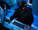 Fire Controlman Second Class Marcos Reyes, from Mount Vernon, Wa., assigned to Arleigh-Burke class guided missile destroyer USS Barry (DDG 52), stands gun fire control system watch in the ship’s combat information center during bi-lateral exercise Resilient Shield 2021.  Resilient Shield is an annual computer-based Fleet Synthetic Training-Joint (FST-J) exercise focused on Ballistic Missile Defense (BMD), designed to test U.S. Naval tactics, techniques and procedures (TTPs) against potential regional threats while ensuring Japanese and U.S. forces are well-rehearsed in executing those TTPs in the 7th Fleet area of operations. As the U.S. Navy's largest forward-deployed fleet, 7th Fleet employs 50 to 70 ships and submarines across the Western Pacific and Indian Oceans. U.S. 7th Fleet routinely operates and interacts with 35 maritime nations while conducting missions to preserve and protect a free and open Indo-Pacific region.