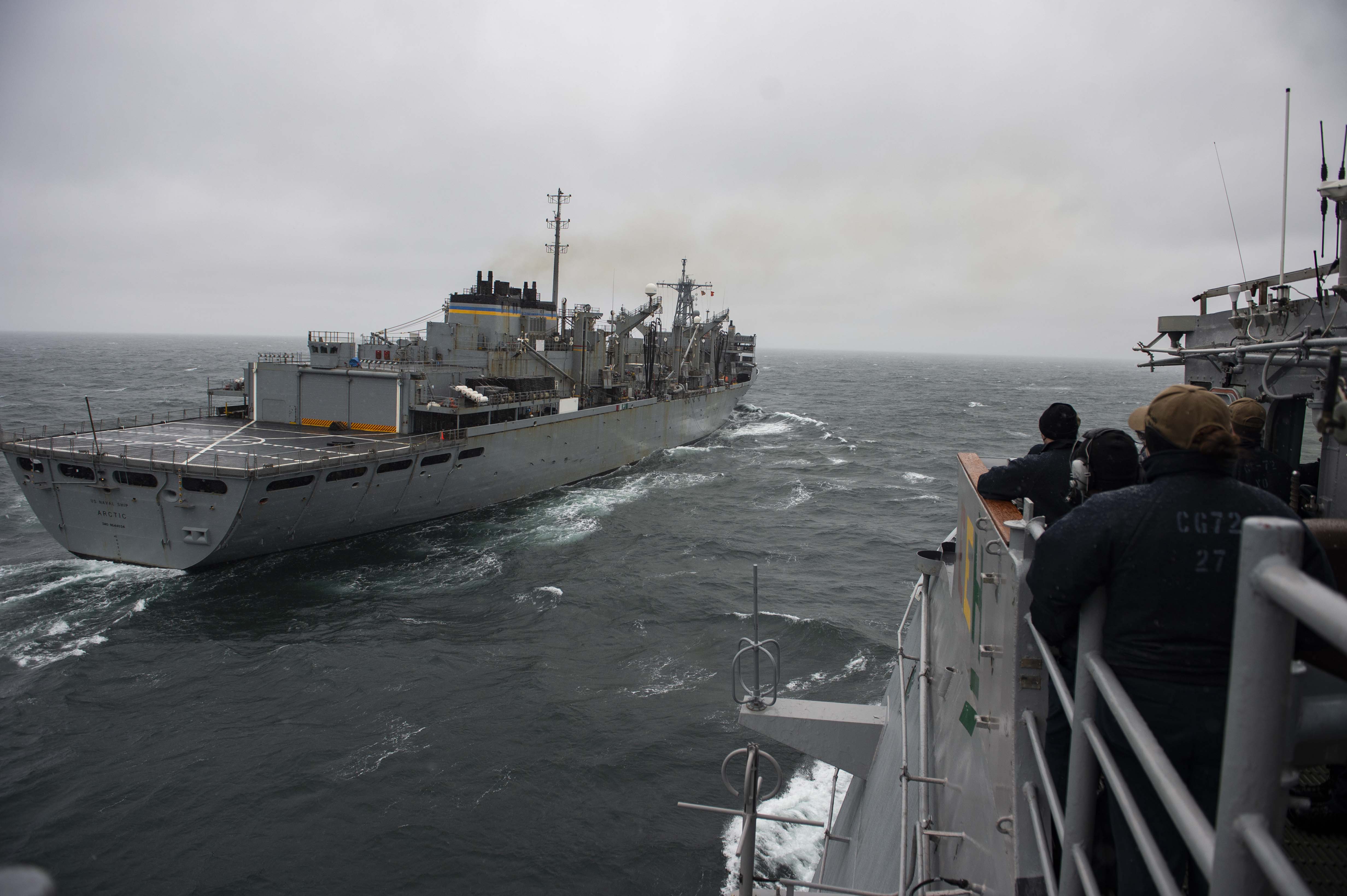 The Ticonderoga-class guided-missile cruiser USS Vella Gulf (CG 72), comes alongside the fast combat support ship USNS Arctic (T-AOE 8) for a replenishment-at-sea, Feb. 19, 2021.