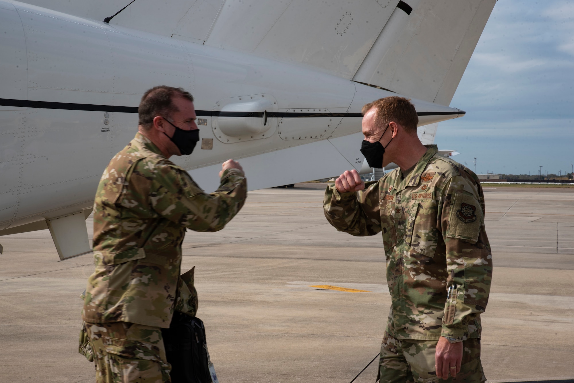 U.S. Air Force Col. Ben Jonsson, 6th Air Refueling Wing commander, greets Maj. Gen. Thad Bibb Jr., 18th Air Force commander and Chief Master Sgt. Chad Bickley, 18th Air Force command chief, Feb. 17, 2021 at MacDill Air Force Base, Fla.