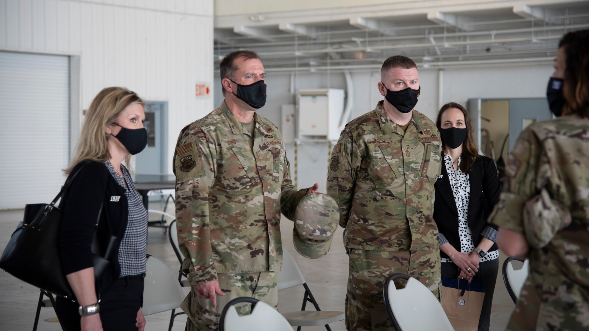 U.S. Air Force Maj. Gen. Thad Bibb Jr., 18th Air Force commander and Chief Master Sgt. Chad Bickley, 18th Air Force command chief listen to a briefing outside of the 6th Medical group, Feb. 19, 2021 at MacDill Air Force Base, Fla.