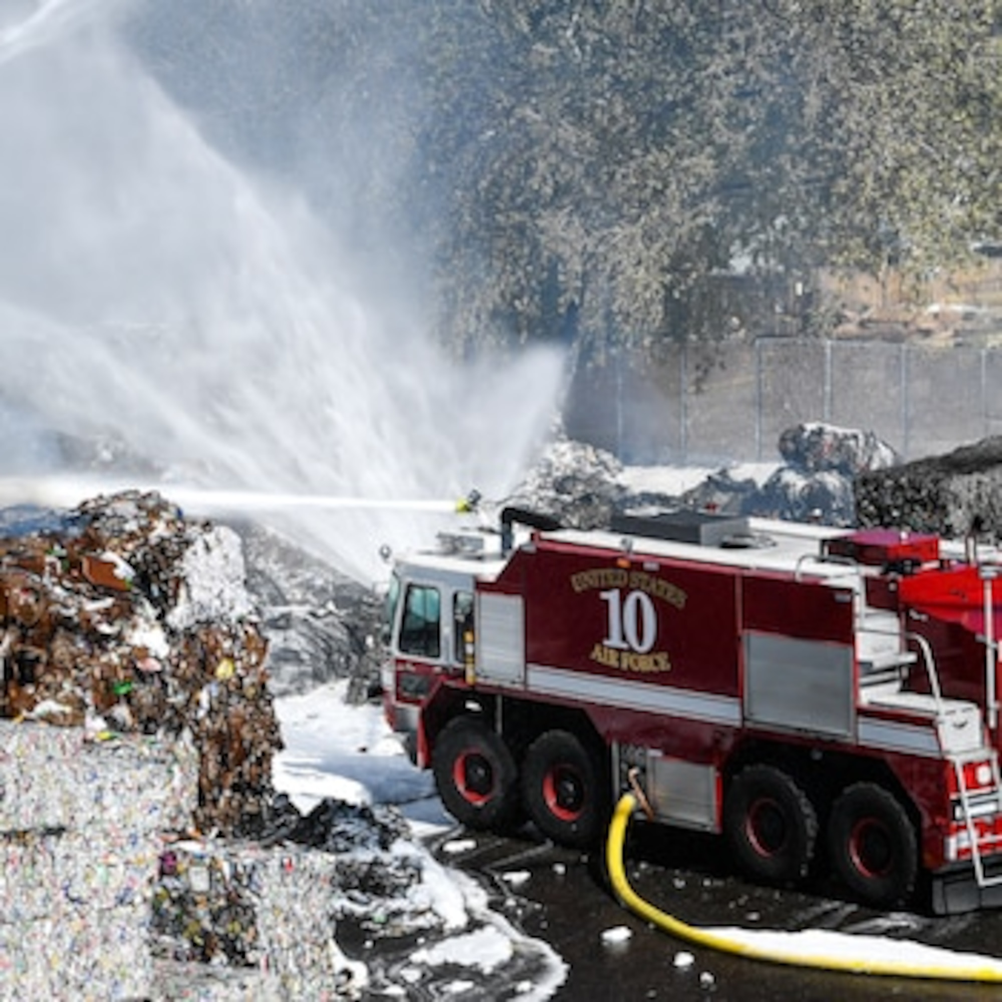 Firefighters from Kirtland Air Force Base, New Mexico, respond to a fire in Albuquerque.