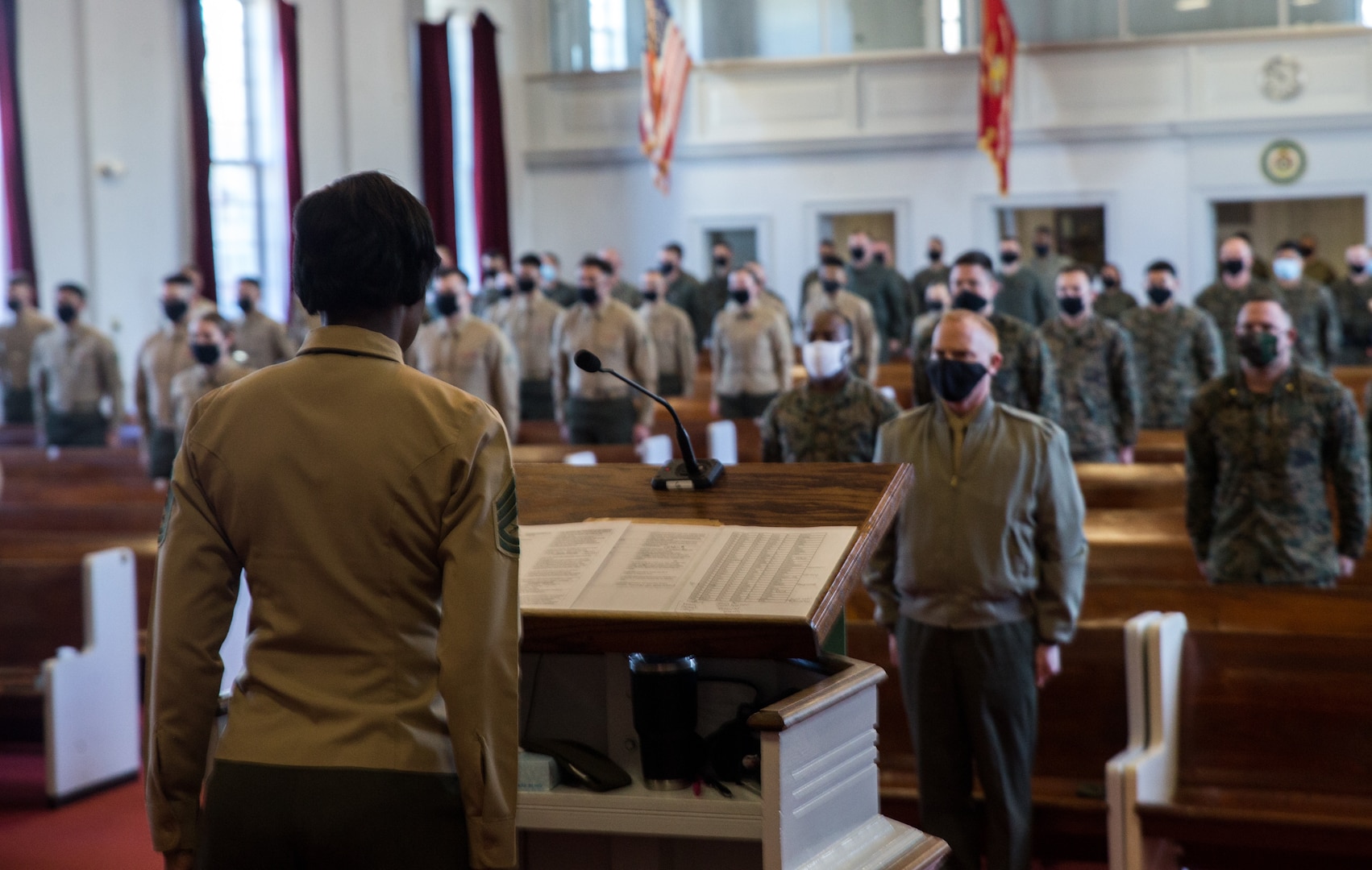 Marines stand at attention for “Anchors Aweigh” during graduation ceremony for Lance Corporal Leadership and Ethics Seminar, Class 1-21, at Marine Corps Air Station, Cherry Point, North Carolina, January 28, 2021 (U.S. Marine Corps/Michael Neuenhoff)