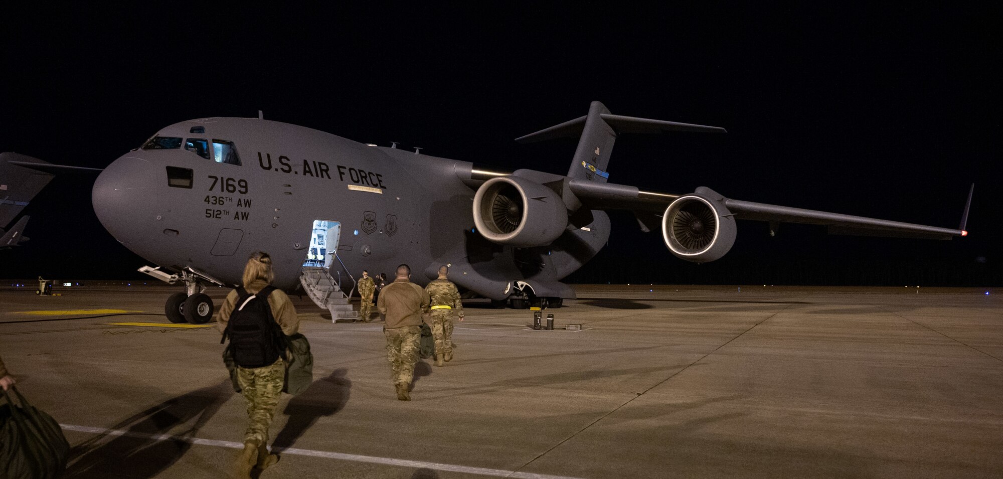 Airmen from Dover Air Force Base board a C-17 Globemaster III during a simulated deployment exercise at Dover Air Force Base, Delaware, Feb. 17, 2021. The Liberty Eagle Readiness Exercise evaluated Team Dover’s ability to rapidly deploy Airmen, Guardians and equipment with limited notice. (U.S. Air Force photo by Airman 1st Class Faith Schaefer)