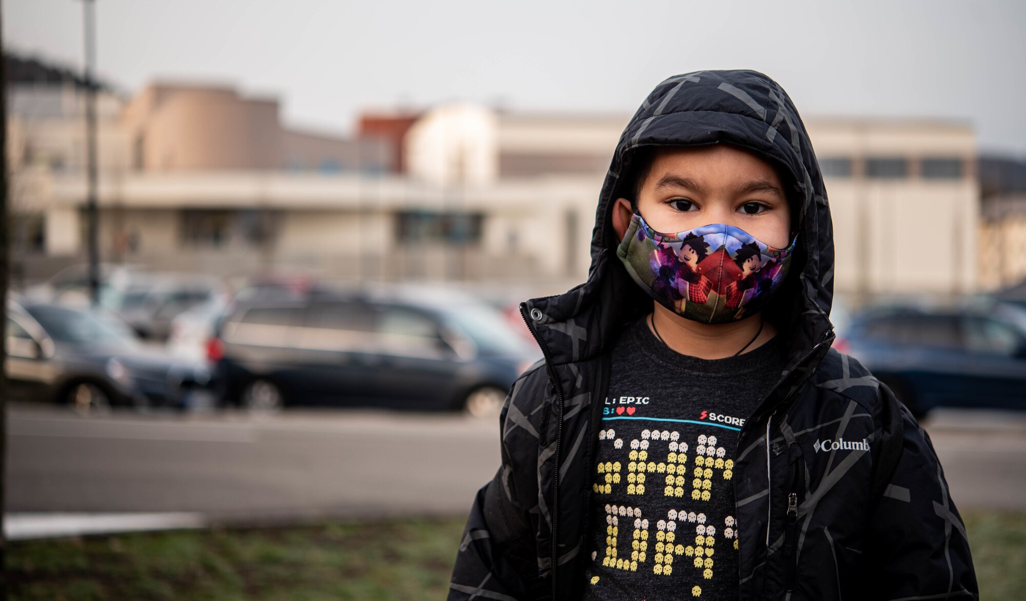 Raiden, son of Airman 1st Class Andrew Alvarado, 86th Airlift Wing public affairs journeyman, poses for a photo in front of Vogelweh Elementary School at Vogelweh Military Complex, Germany, Feb. 22, 2021.