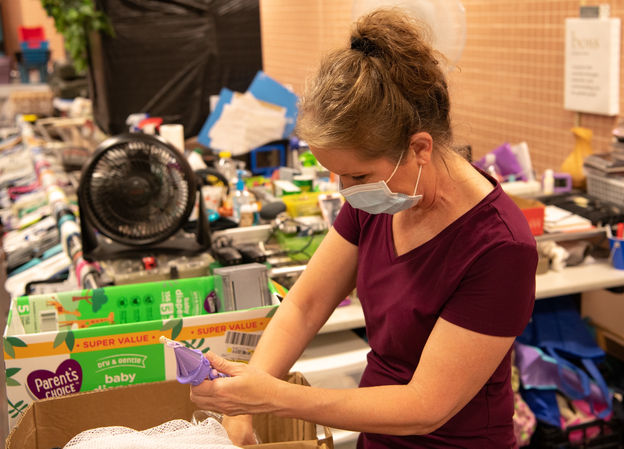 Deborah Skelton, Airman’s Attic program director, sorts through various donations in the backroom of the Airman’s Attic at Travis Air Force Base, California, on Oct. 17, 2020.