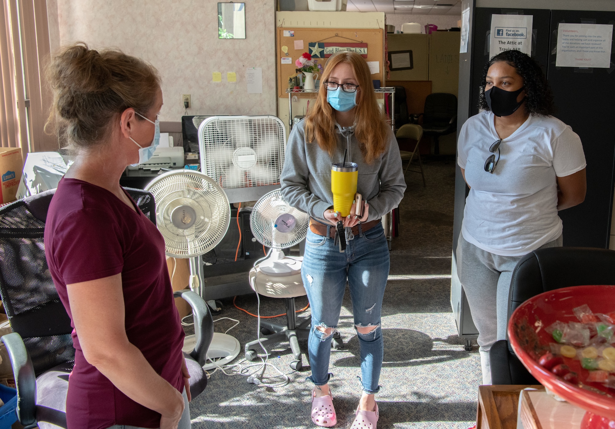 Deborah Skelton, Airman’s Attic program director, prepares volunteers Senior Airman Lolita Komleva and Airman Dynaeja Nimmons to work at the Airman’s Attic at Travis Air Force Base in California, on Oct. 17, 2020.