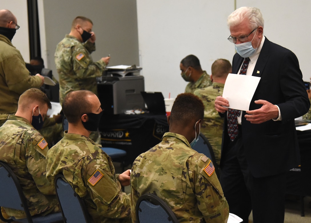 Michael Muldowney, one of two personal financial counselors available to Virginia National Guard personnel, offer services to VNG Soldiers assigned to the Staunton-based 116th Infantry Brigade Combat Team, 116th Infantry Regiment, as the out-process from duty in Washington, D.C. Feb. 8, 2021, at Maneuver Training Center Fort Pickett.