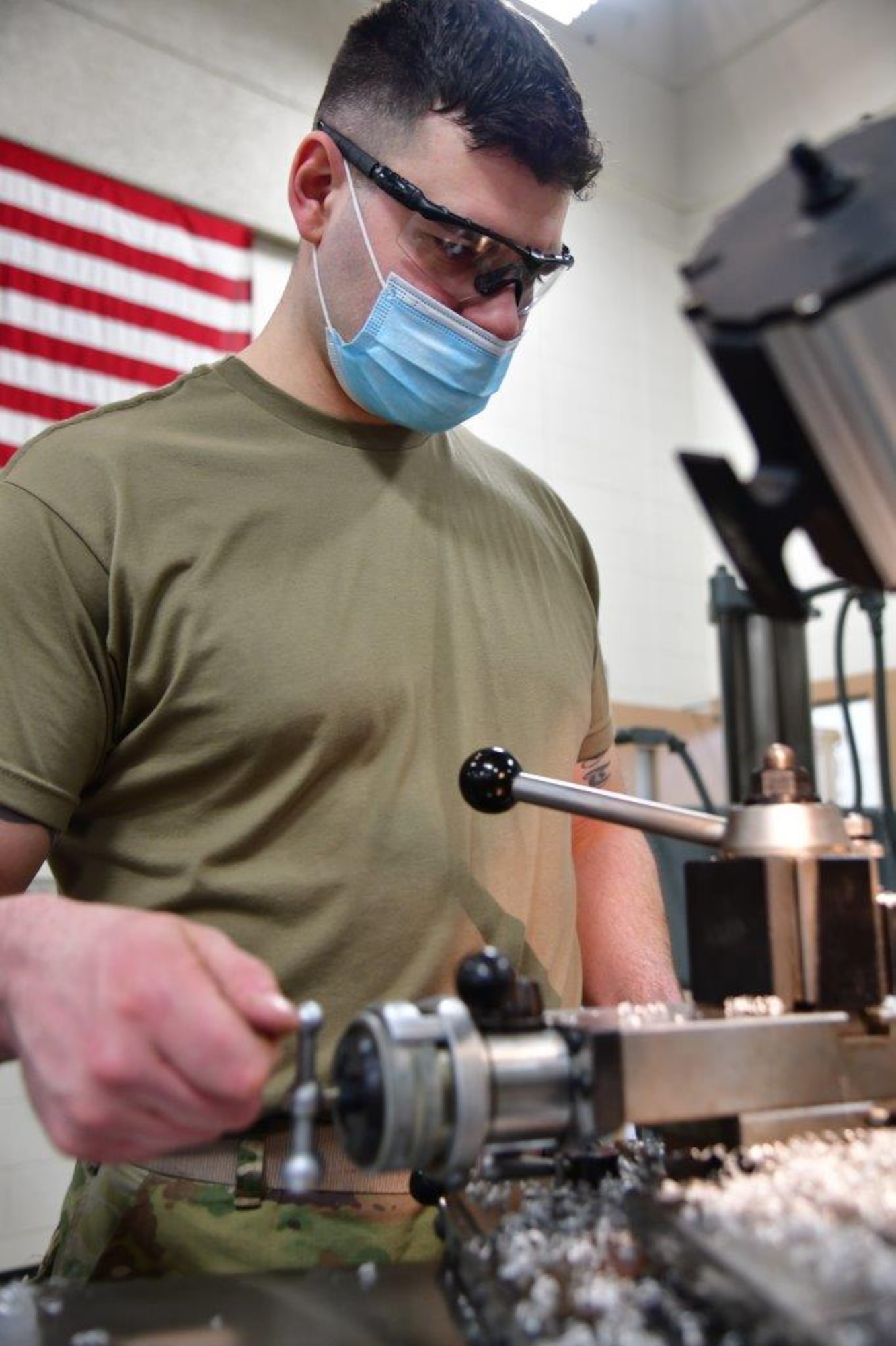 148th Fighter Wing Aircraft Metals Technician, Tech. Sgt. Jason Johnston, uses a lathe to make support equipment on Feb. 21, 2021.  (U.S. Air National Guard photo by Tylin Rust)