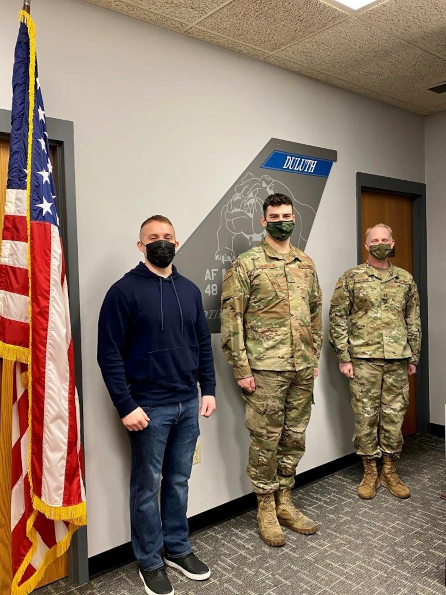 Andy Boso, Tech. Sgt. Jason Johnston and Capt. Josh Kolkind pose for a photo after Boso and Johnston took the Oath of Enlistment on Feb. 2, 2021. (U.S. Air National Guard photo by Audra Flanagan)