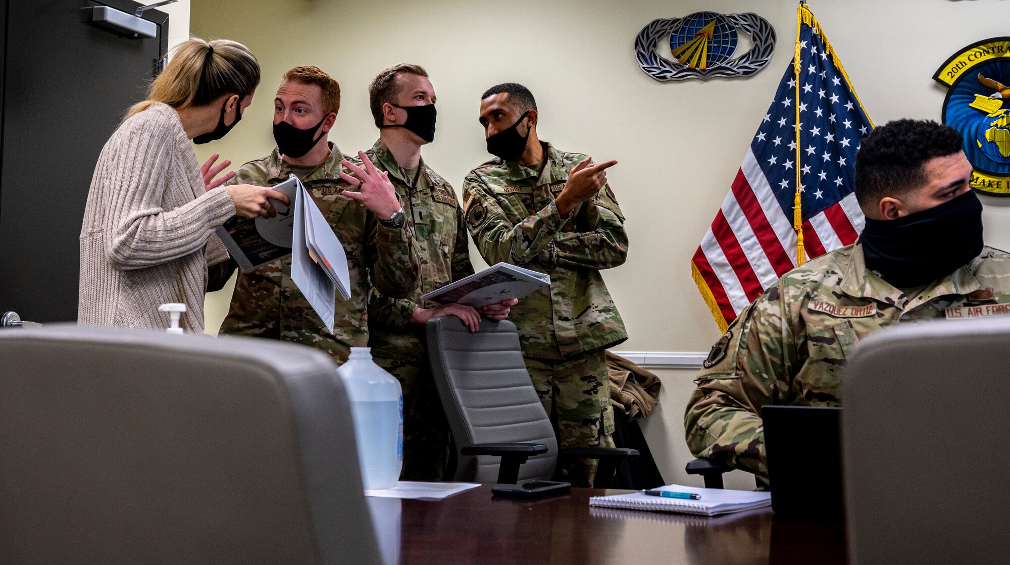 A photo of 20th Contracting Squadron members standing and talking.