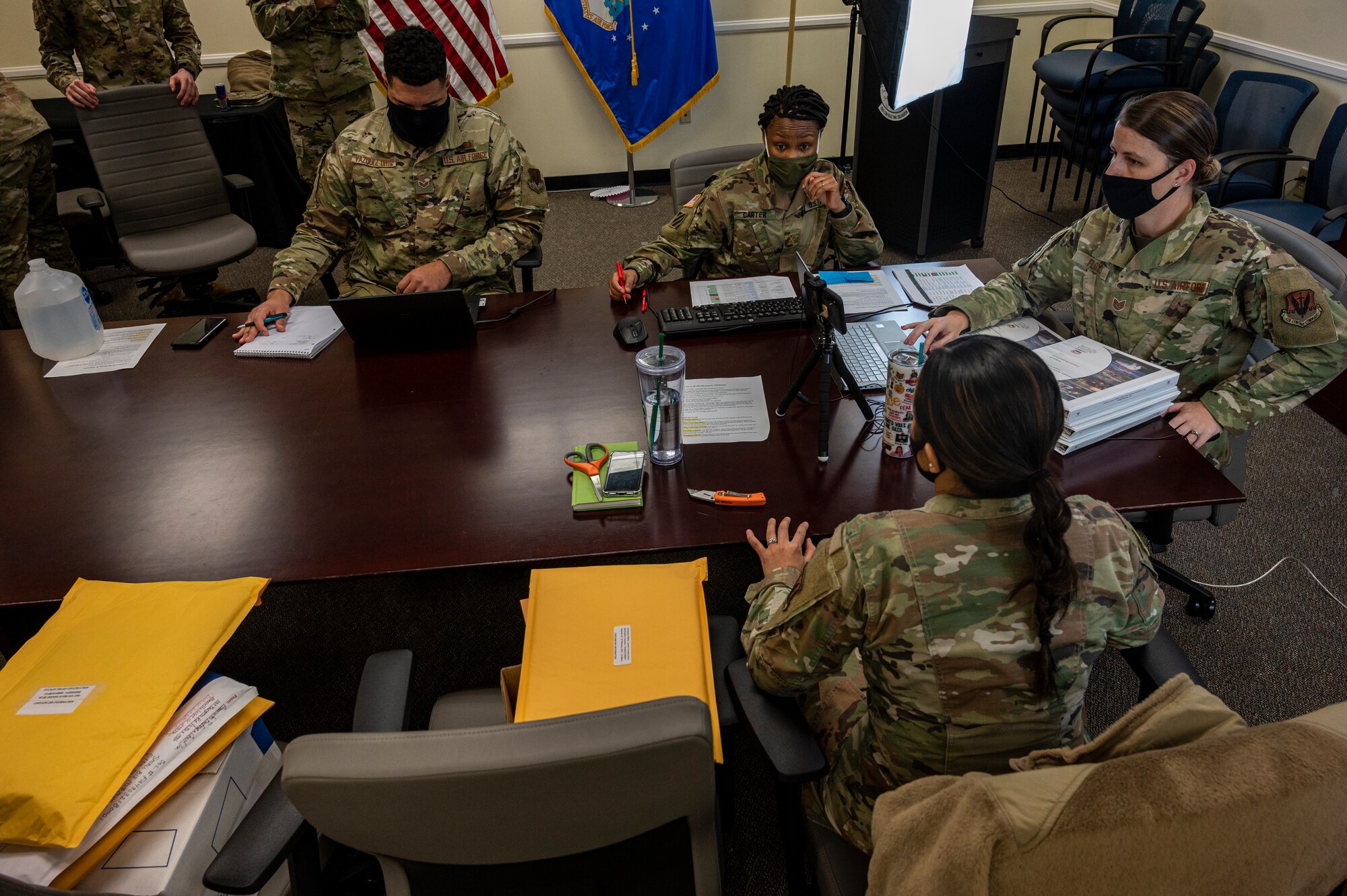 A photo of 20th Contracting Squadron members sitting at a table.