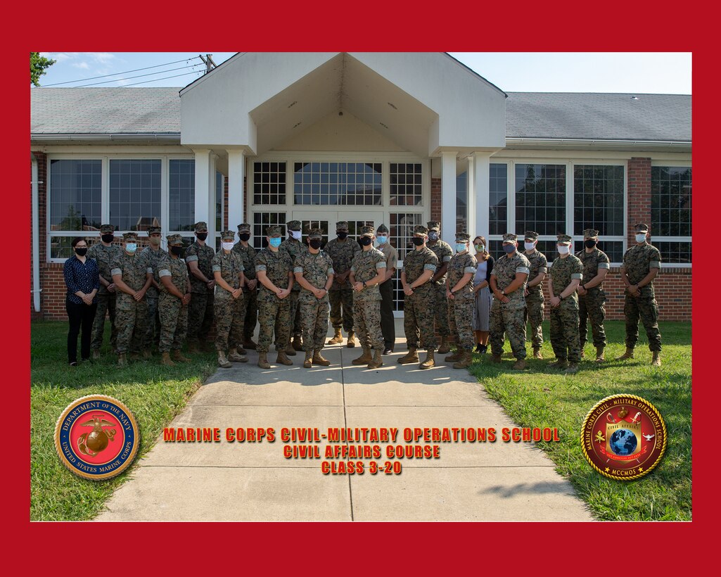 U.S. Marines and staff members with Marine Corps Civil-Military Operations School pose for a group photo at Marine Corps Civil-Military Operations School