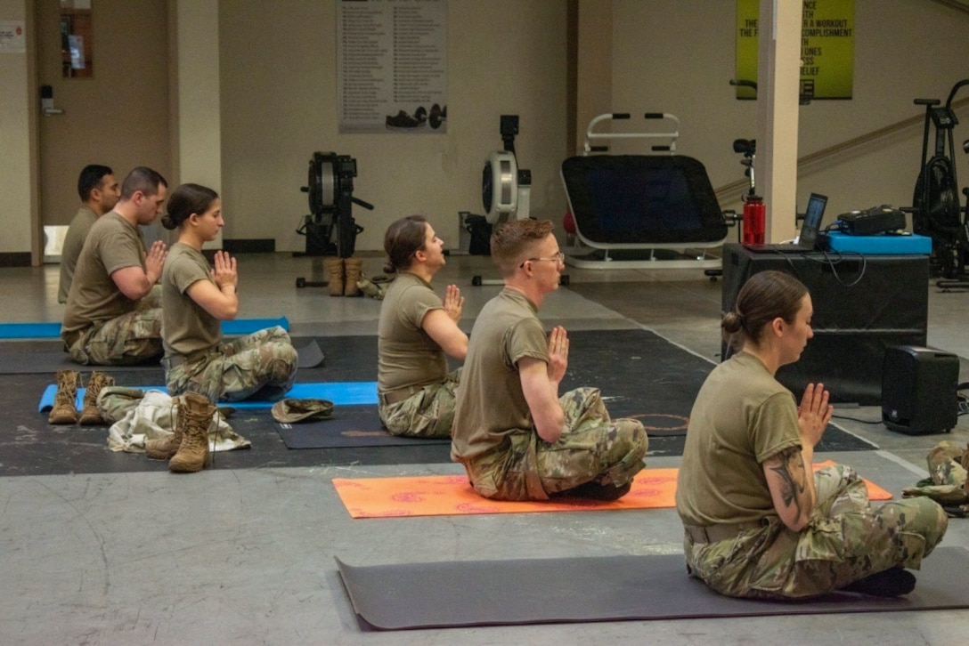 Soldiers participate in a yoga session.