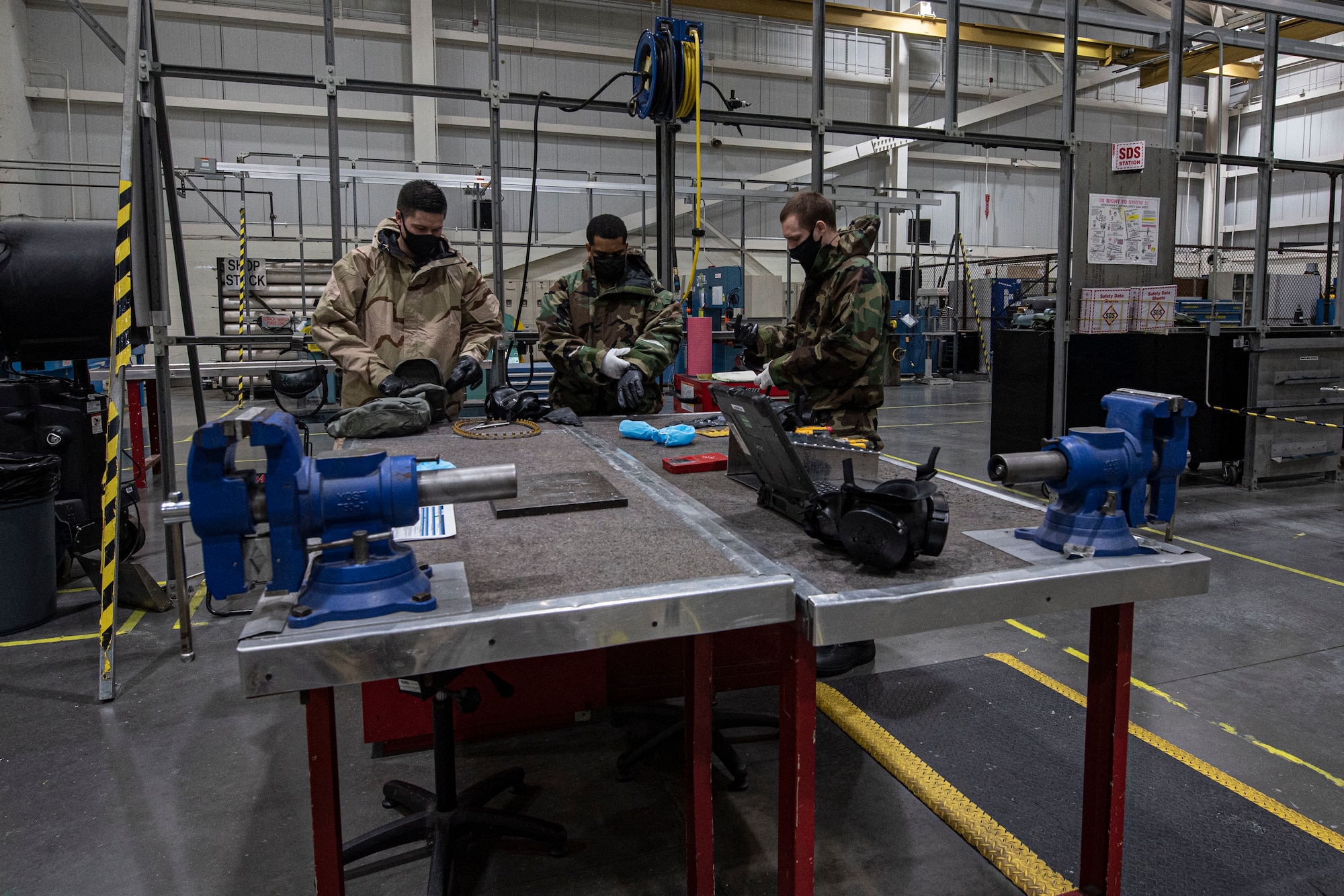 Photo of Airmen preparing to perform task qualification training.