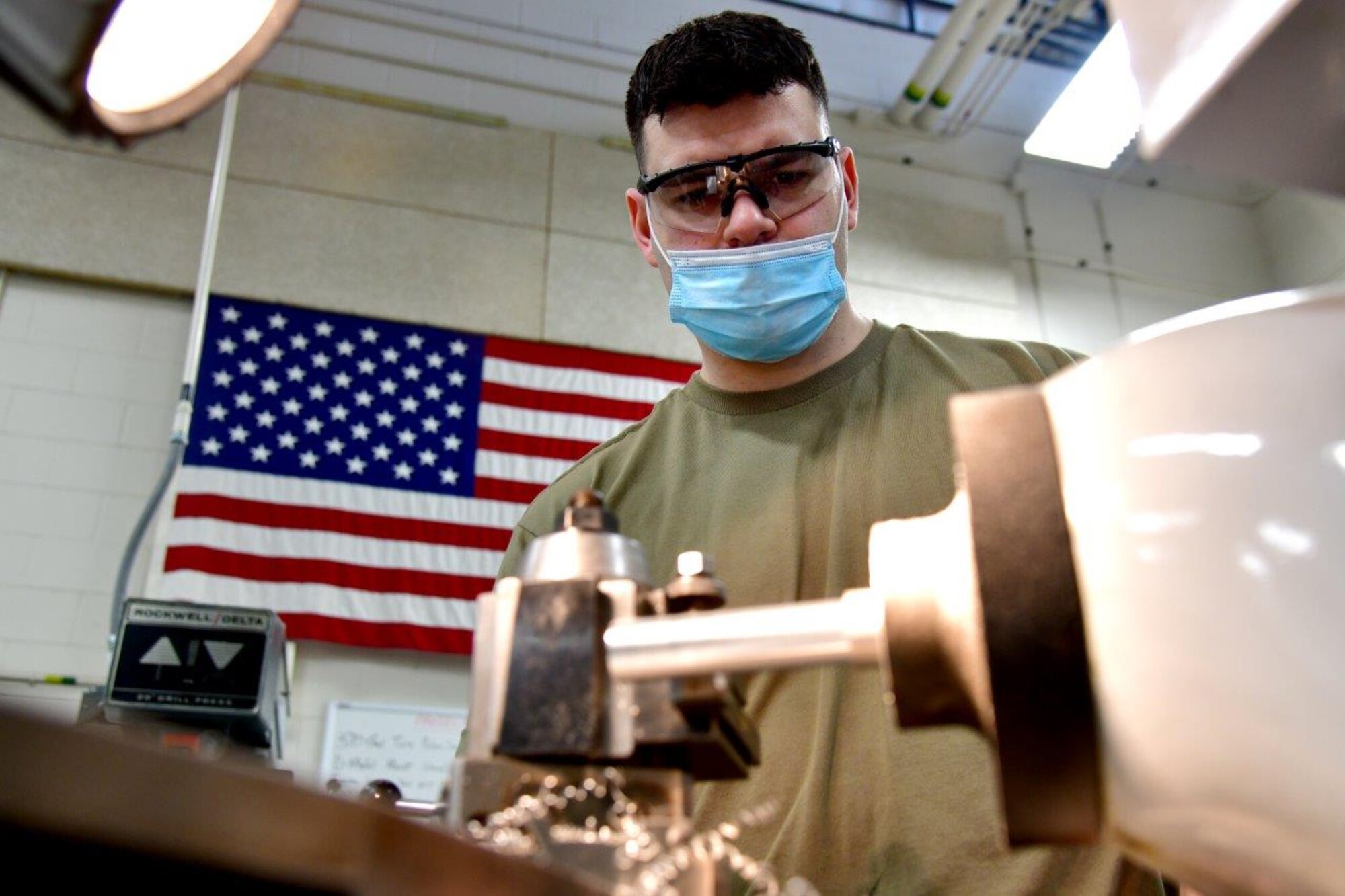 148th Fighter Wing Aircraft Metals Technician, Tech. Sgt. Jason Johnston, uses a lathe to make support equipment on Feb. 21, 2021.  (U.S. Air National Guard photo by Tylin Rust)