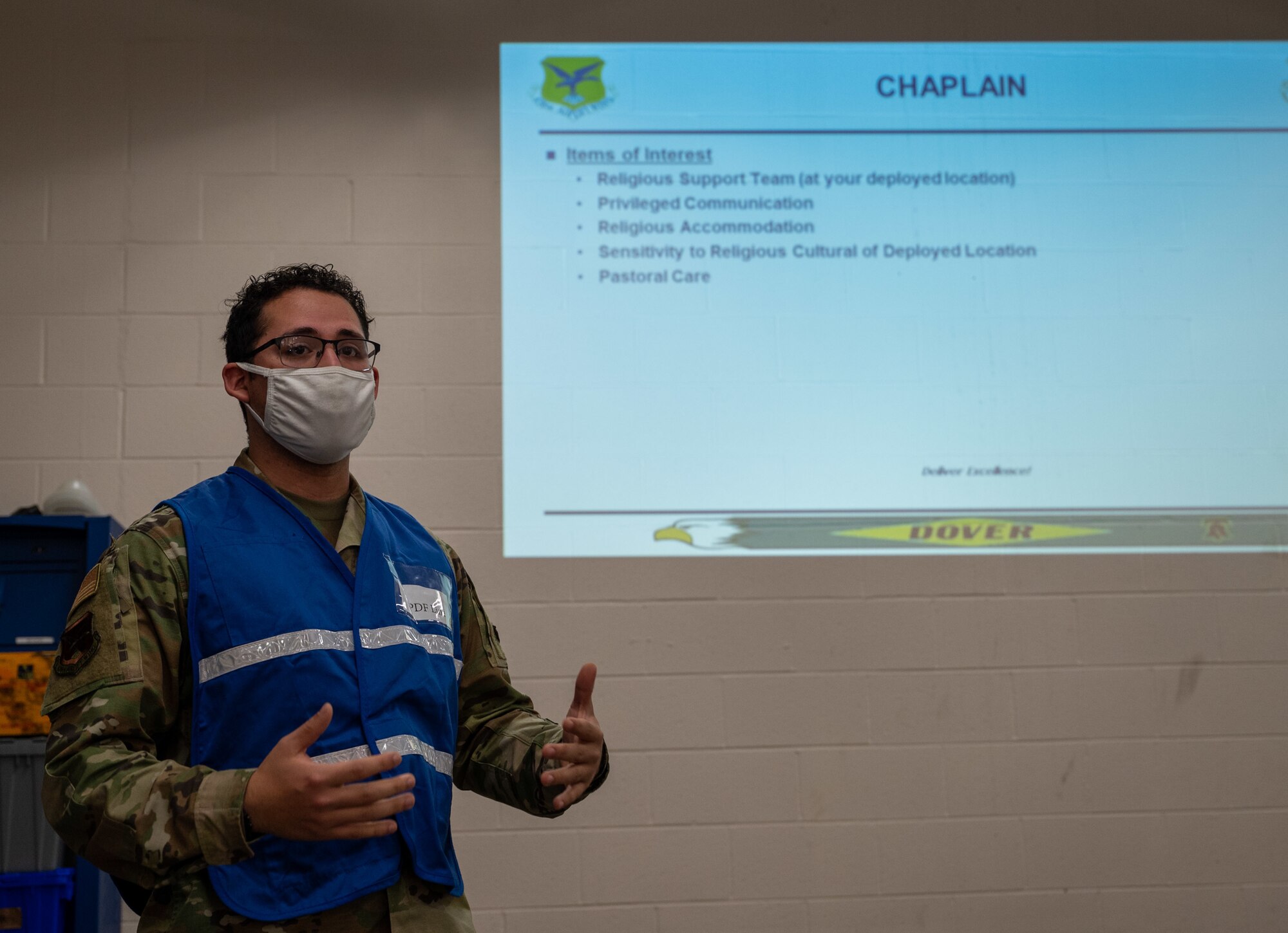 Airman 1st Class Benito Reina, 436th Airlift Wing chaplain assistant, delivers a briefing during a simulated deployment exercise at Dover Air Force Base, Delaware, Feb. 17 2021. The Liberty Eagle Readiness Exercise evaluated Team Dover’s ability to rapidly deploy Airmen, Guardians and equipment with limited notice. (U.S. Air Force photo by Airman 1st Class Faith Schaefer)