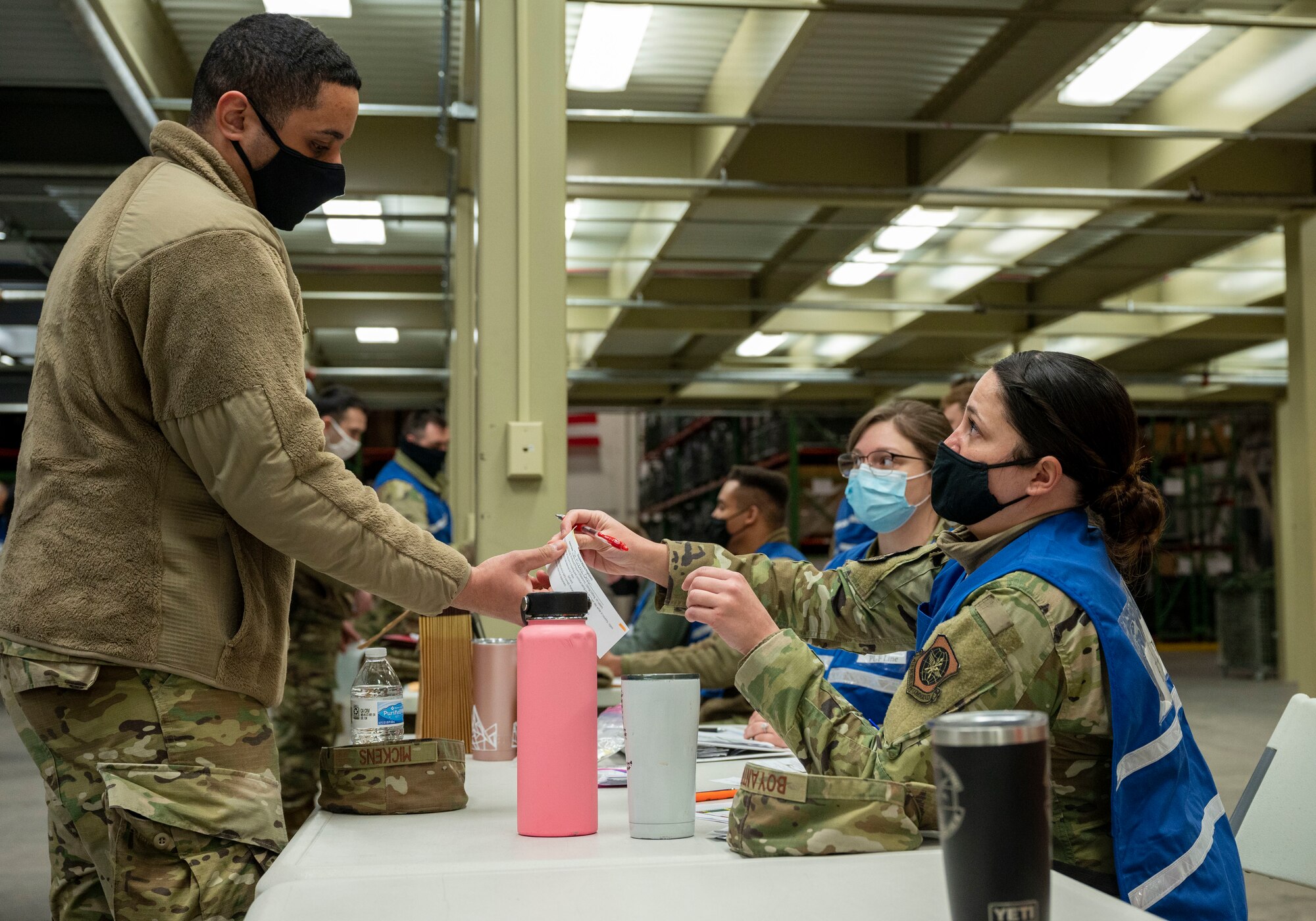 Tech. Sgt Omar Mickens, 436th Airlift Wing executive services noncommissioned officer in charge, processes through a personnel deployment function line during the Liberty Eagle Readiness Exercise at Dover Air Force Base, Delaware, Feb. 17, 2021. The exercise evaluated Team Dover’s ability to rapidly deploy Airmen, Guardians and equipment with limited notice. (U.S. Air Force photo by Airman First Class Cydney Lee)