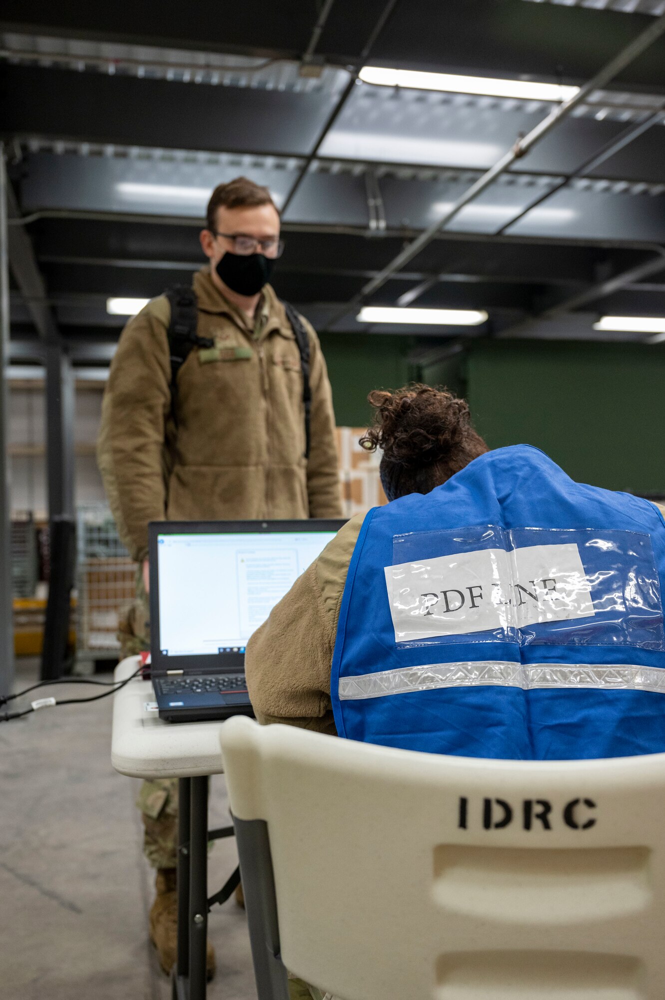 Senior Airman Evan Dar, 436th Maintenance Squadron communication, navigation and electronic warfare craftsman, processes through a personnel deployment function line during the Liberty Eagle Readiness Exercise at Dover Air Force Base, Delaware, Feb. 17, 2021. The exercise evaluated Team Dover’s ability to rapidly deploy Airmen, Guardians and equipment with limited notice.  (U.S. Air Force photo by Airman First Class Cydney Lee)