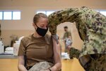 YOKOSUKA, Japan (Jan. 7, 2021) Machinist’s Mate (Nuclear) 1st Class Sian Tweeddale, assigned to the U.S. Navy’s only forward-deployed aircraft carrier, USS Ronald Reagan (CVN 76), receives the COVID-19 vaccine on Commander, Fleet Activities Yokosuka (CFAY). Medical personnel and strategic forces were the first to receive the COVID-19 vaccine. Ronald Reagan returned to Yokosuka in November 2020 following a six-month deployment in the U.S. 7th Fleet area of responsibility.