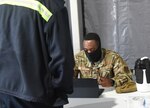 Virginia National Guard Soldiers and Airmen provide logistics and operations support at a COVID-19 vaccine point of distribution hosted by the Blue Ridge Health District Feb. 4, 2021, in Charlottesville, Virginia.