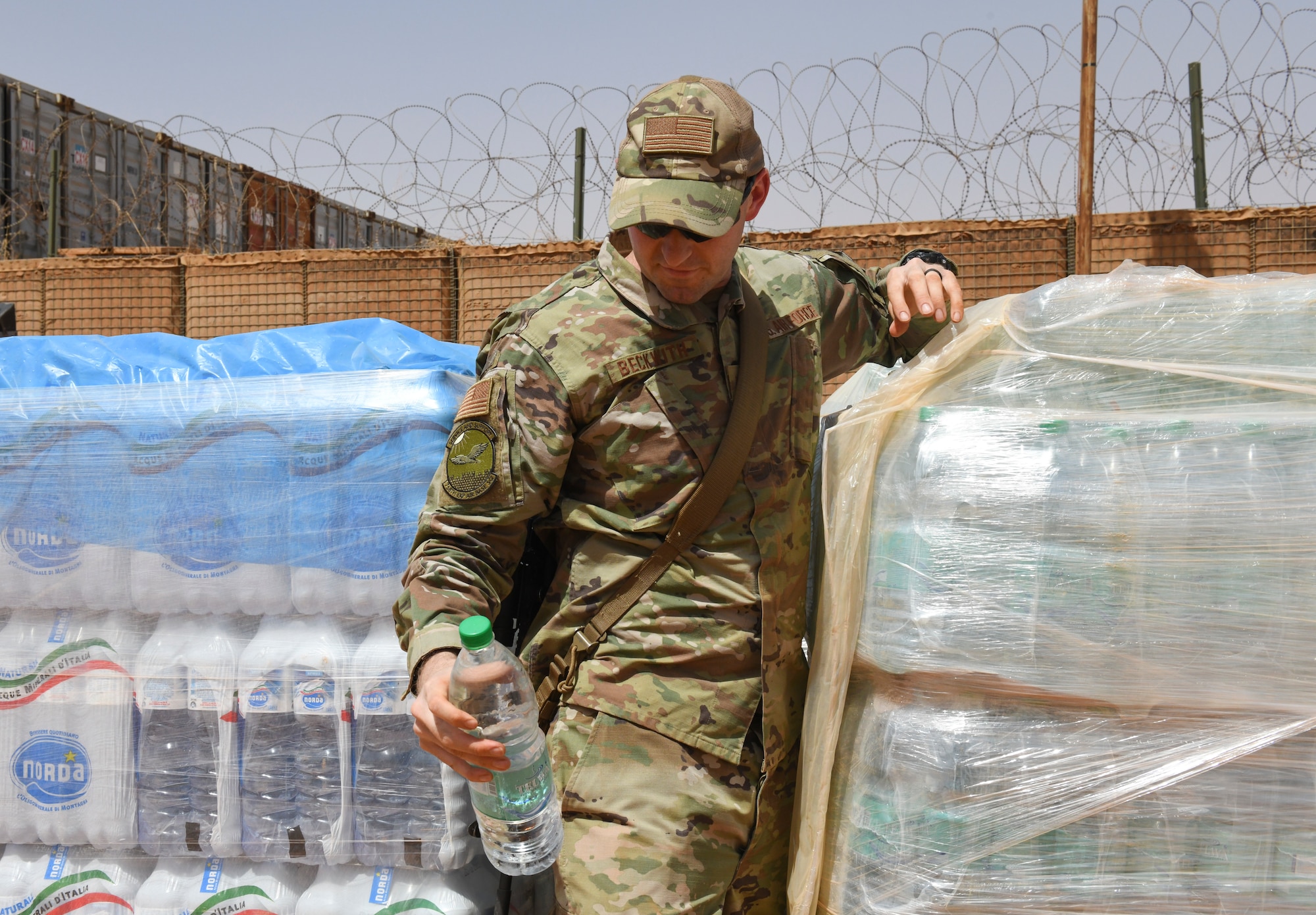 .S. Air Force Tech. Sgt. Kristopher Beckwith, 768th Expeditionary Air Base Squadron bioenvironmental engineer, grabs a water bottle to test the water quality at Nigerien Air Base 101, Niamey, Niger, Feb. 16, 2021.