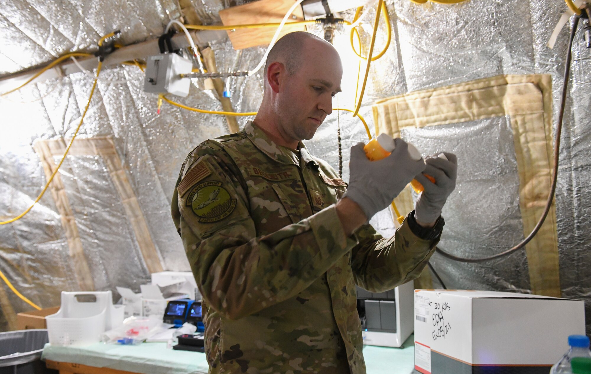 U.S. Air Force Tech. Sgt. Kristopher Beckwith, 768th Expeditionary Air Base Squadron bioenvironmental engineer, shakes the sample jars to thoroughly mix colisure powder and water together at Nigerien Air Base 101, Niamey, Niger, Feb. 16, 2021.