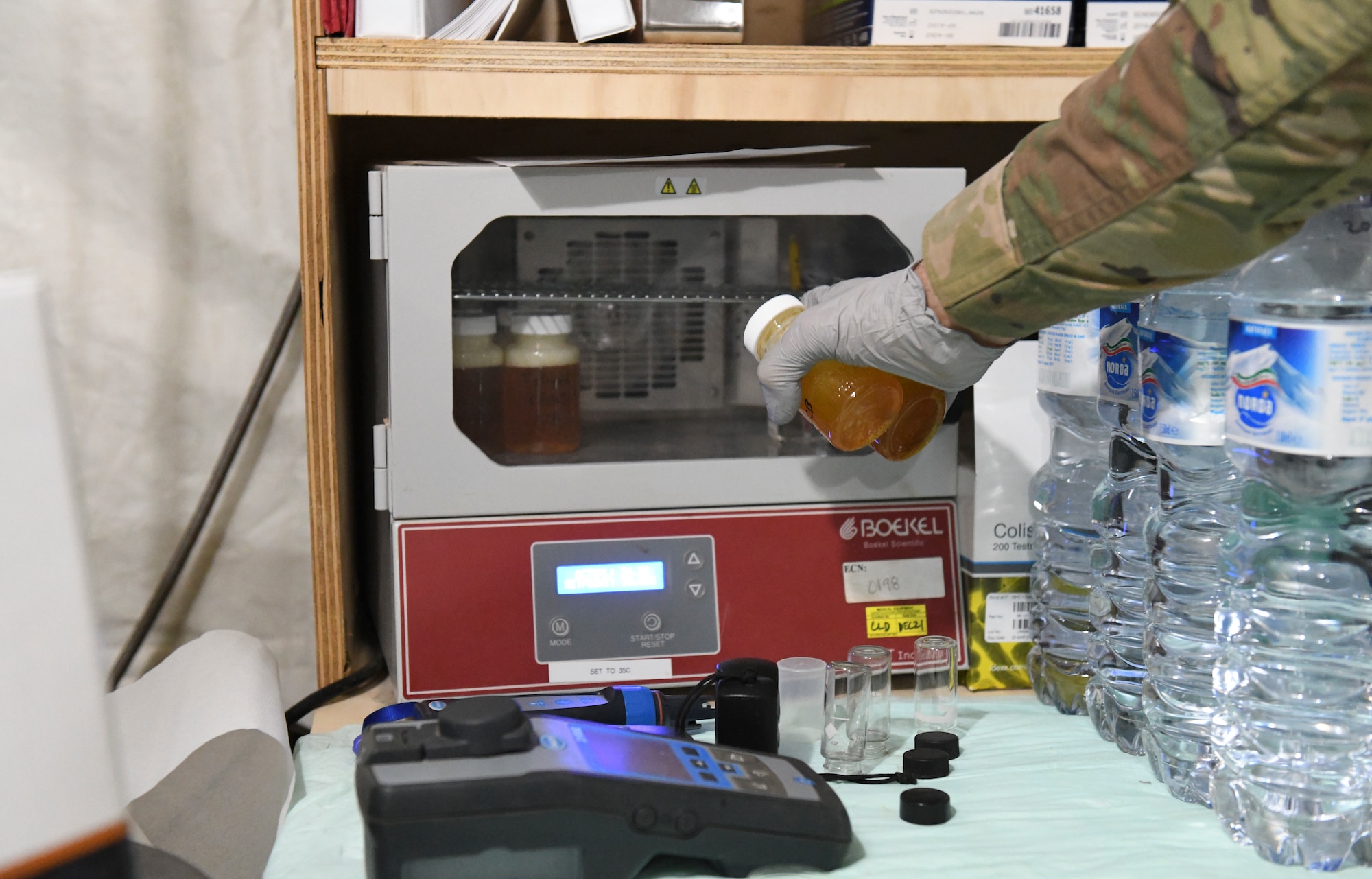 U.S. Air Force Tech. Sgt. Kristopher Beckwith, 768th Expeditionary Air Base Squadron bioenvironmental engineer, puts the sample jars with colisure powder in an incubator to test for water quality at Nigerien Air Base 101, Niamey, Niger, Feb. 16, 2021.