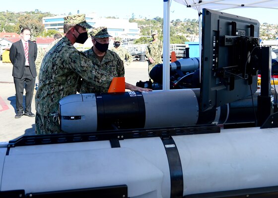 Lt. Cmdr. Nick Stoner, assigned to Explosive Ordnance Disposal Group (EODGRU) 1, discusses unmanned underwater vehicle (UUV) capabilities with Chief of Naval Operations Adm. Mike Gilday at Naval Base Point Loma.