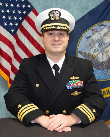 Studio portrait of COMMANDER BRIAN A. FORSTER