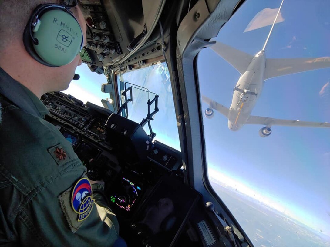 Maj. Raphael Michel of the 313th Airlift Squadron conducts C-17 Globemaster III aerial refueling training with the KC-46 Pegasus tanker Jan. 29. (Courtesy photo)