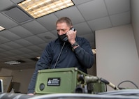 Ron Lockerby, a Joint Task Force Civil Support telecommunications engineer, conducts radio checks with the 20th Engineer Brigade during a command post training exercise on Fort Bragg, N.C., Feb. 24, 2021.