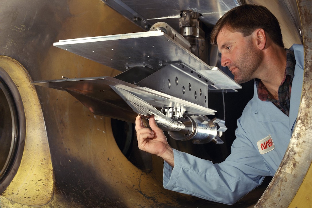 An engineer works on a hypersonic vehicle.