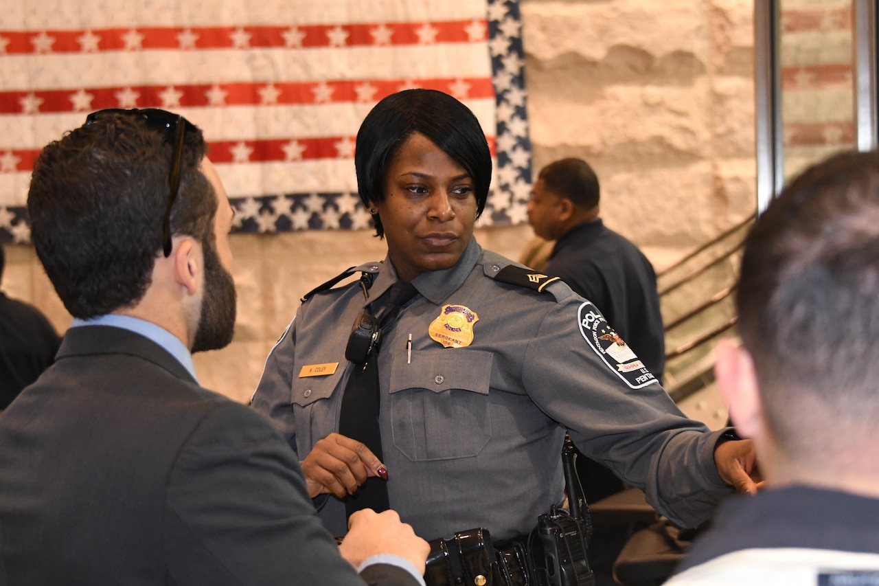 A PFPA sergeant checks credentials at the Pentagon.