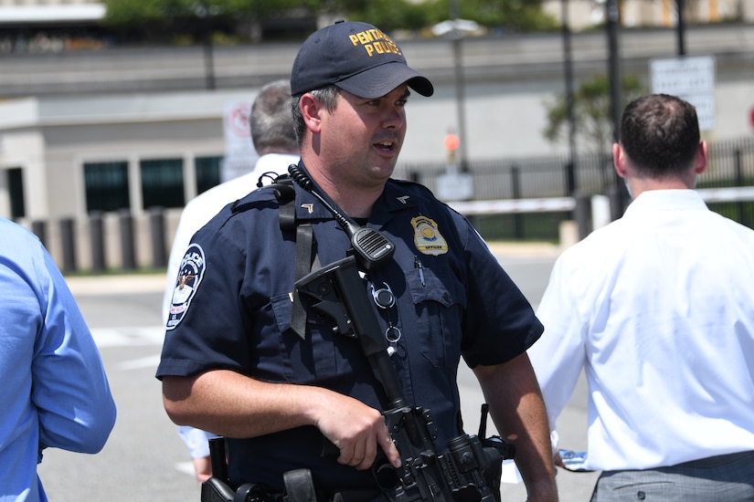 A police officer checks credentials at the Pentagon.