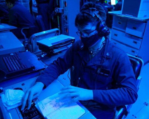 TAIWAN STRAIT (Feb. 23, 2020) -- Fire Controlman (Aeigis) 2nd Class Pavel Gorski, from St. Petersburg, Fla. writes in a watch log aboard the Arleigh Burke-class guided-missile destroyer USS Curtis Wilbur (DDG 54). Curtis Wilbur is assigned to Destroyer Squadron (DESRON) 15, the Navy's largest forward-deployed DESRON and the U.S. 7th Fleet's principal surface force.
