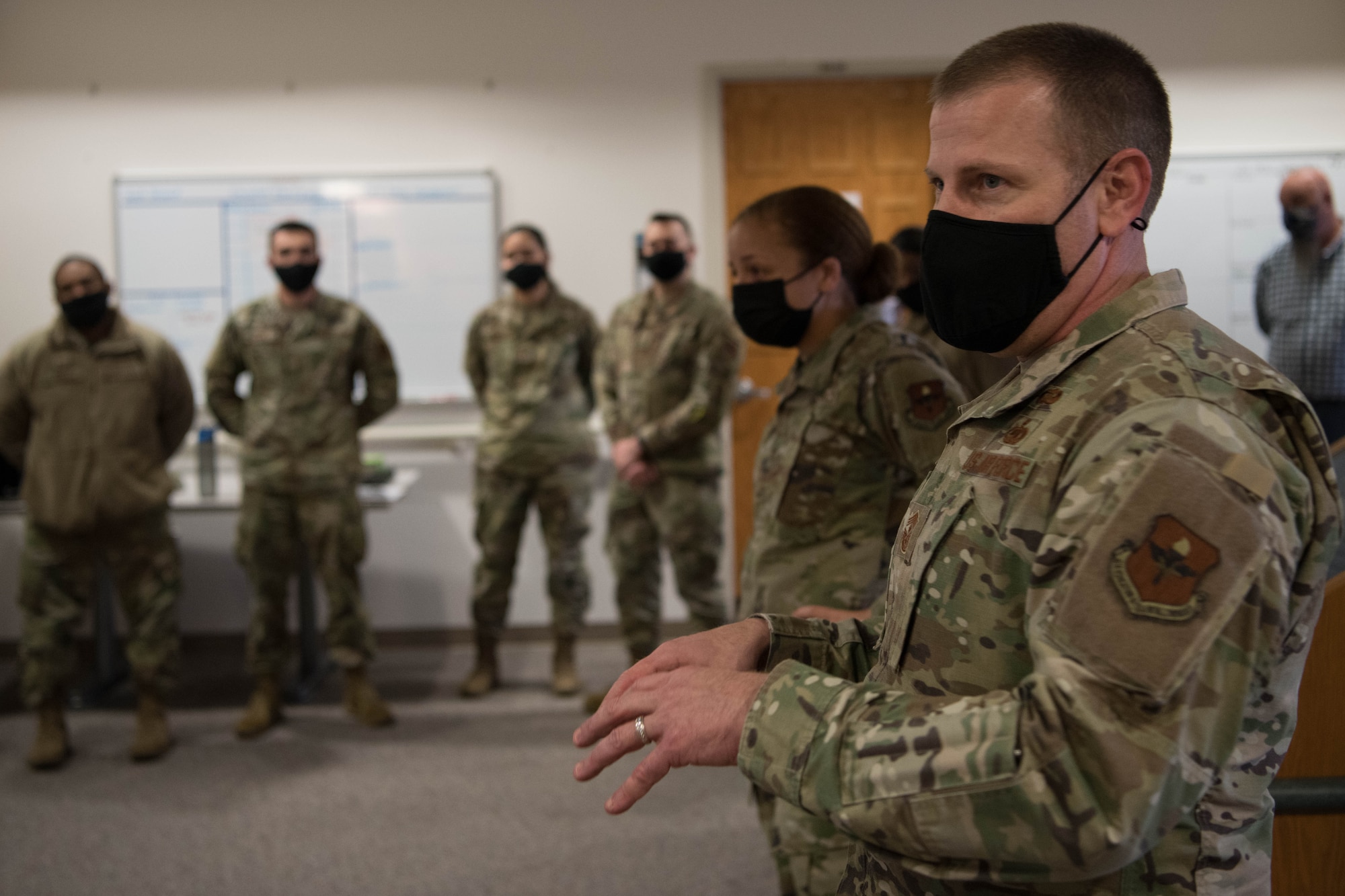 Chief Master Sgt. Mike Morgan, 42nd Air Base Wing command chief, and Col. Eries Mentzer, 42nd ABW commander, speak to 42nd Medical Group Airmen at a deployment send-off on Maxwell Air Force Base, Ala. June 18, 2020. The 42nd ABW command team wished the team luck with their deployment to Brooklyn, New York, to support the Federal Emergency Management Agency with vaccine administration.