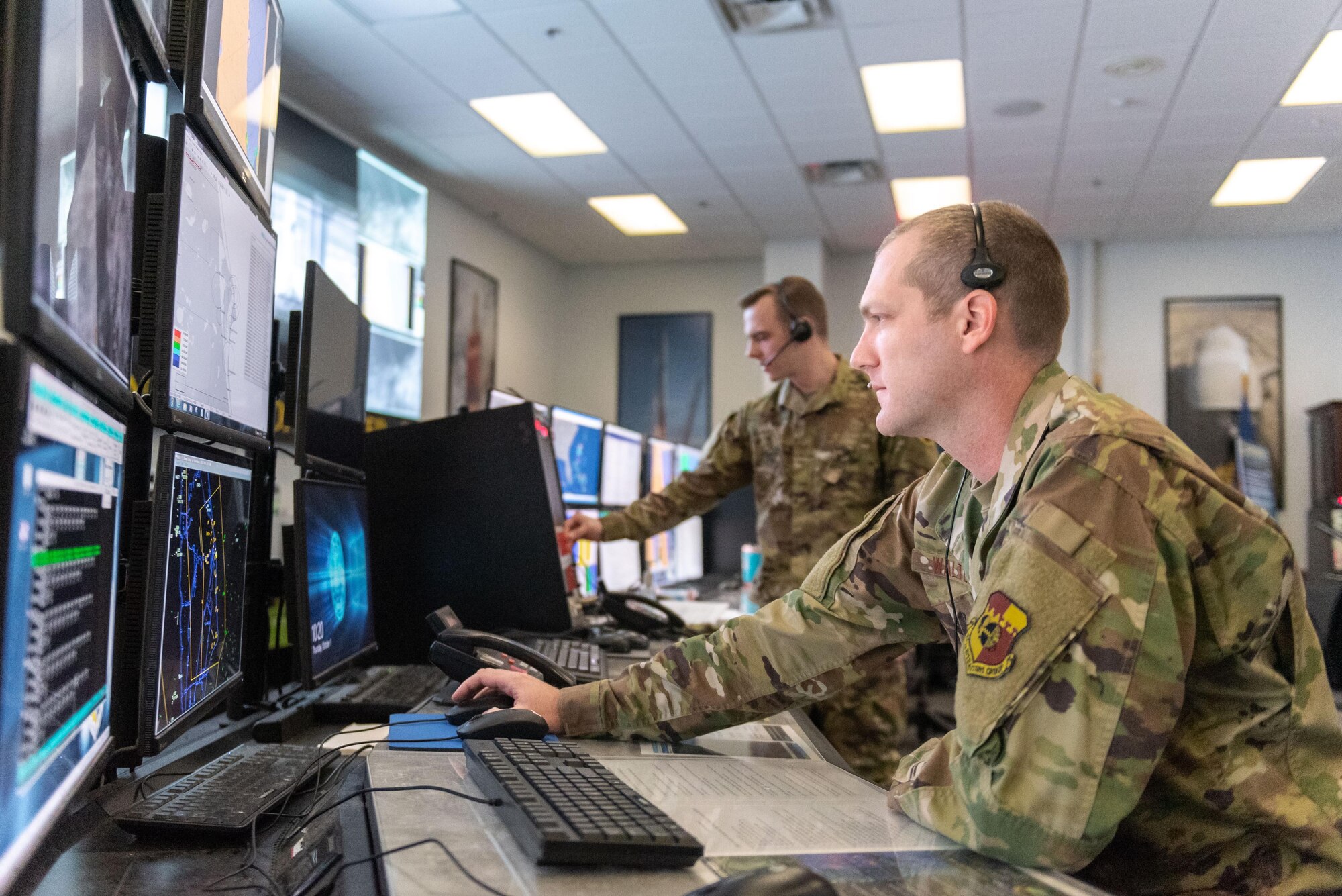 Two members of the 45th Weather Squadron monitor weather at the Morrell Operations Center, Cape Canaveral Space Force Station, Fla., on Oct. 1, 2020. With over five decades of space exploration under our belts, the 45th Space Wing has also changed with the times; in fact, the 45th Weather Squadron has geared up to make many changes in order to enhance their weather operations. (U.S. Air Force photo by Josh Conti)