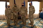 Airman stop to receive their awards during a ceremony