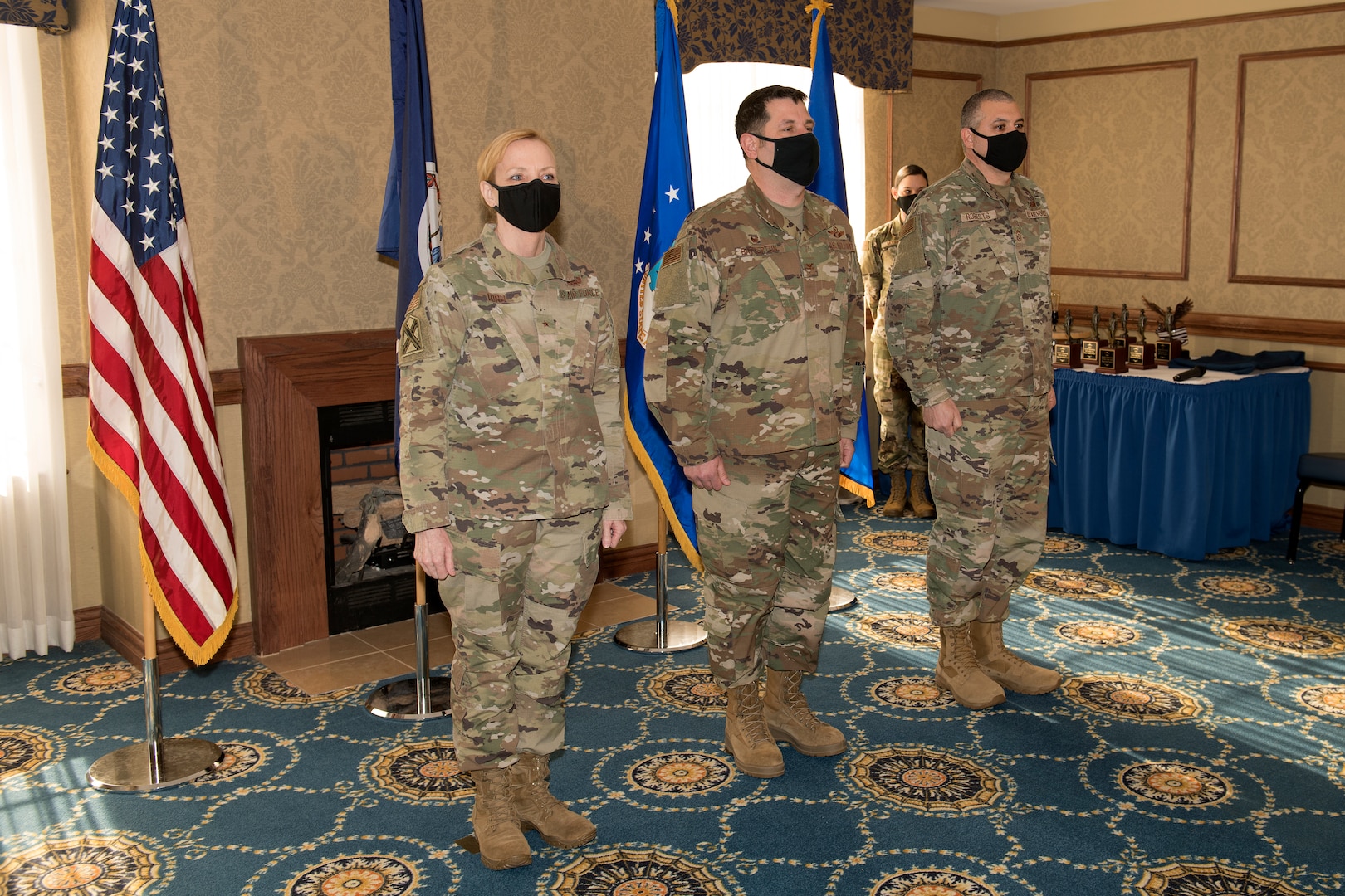 Military leaders stand at attention during a ceremony