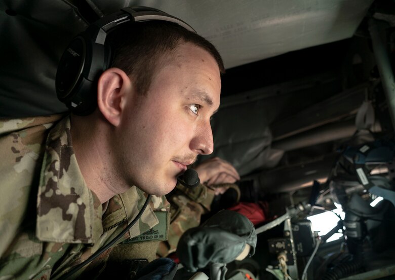 A U.S. Air Force KC-135 Stratotanker in-flight refueling specialist maneuvers the boom in order to provide fuel to an F-16 Fighting Falcon during a routine mission over the U.S. Central Command area of responsibility, Feb. 16th, 2021.