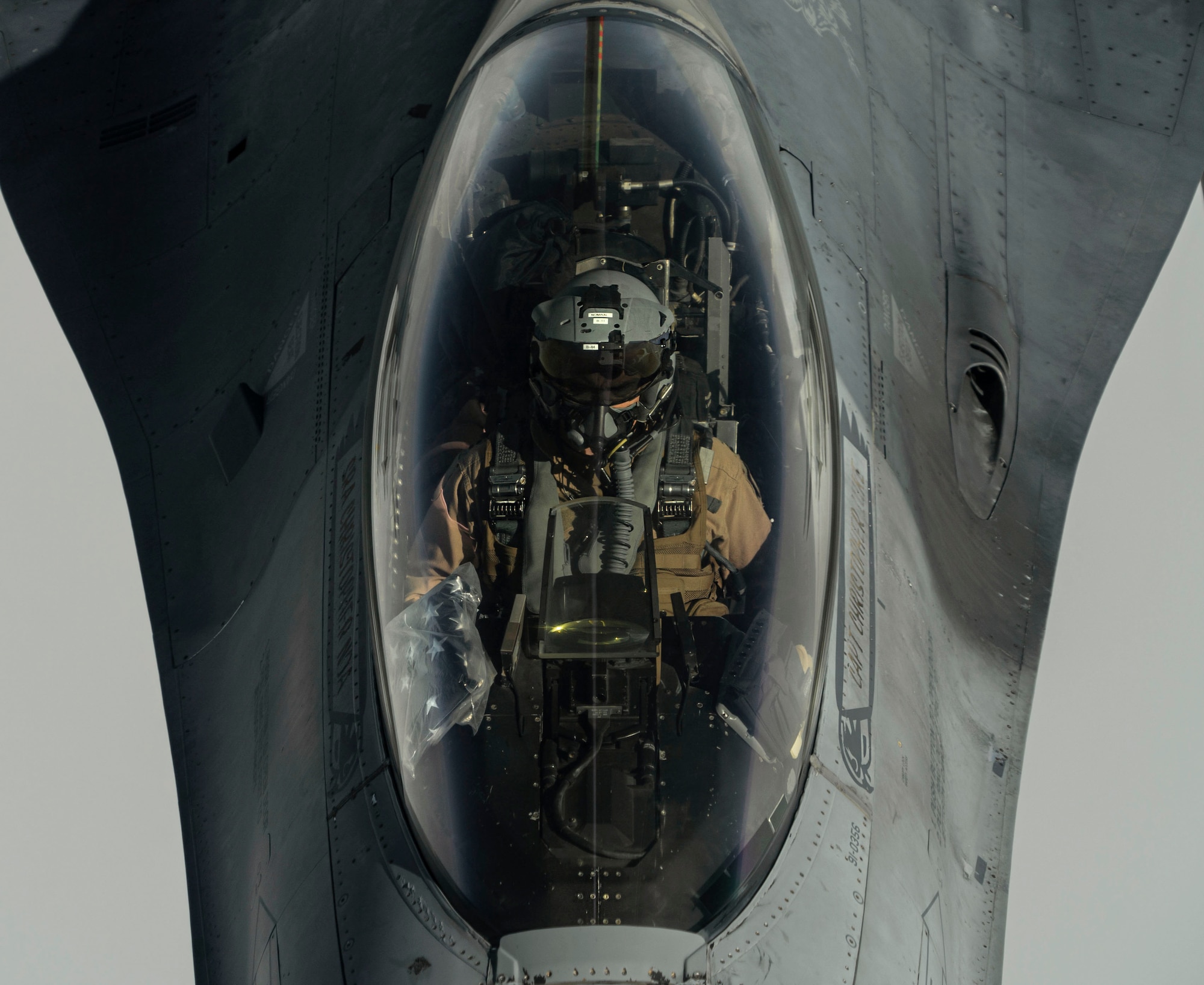 A U.S. Air Force F-16 Fighting Falcon pilot maneuvers his aircraft into position while receiving fuel from a KC-135 Stratotanker, assigned to the 340th Expeditionary Aircraft Refueling Squadron, while flying routine operations over Southwest Asia Feb. 16th, 2021.