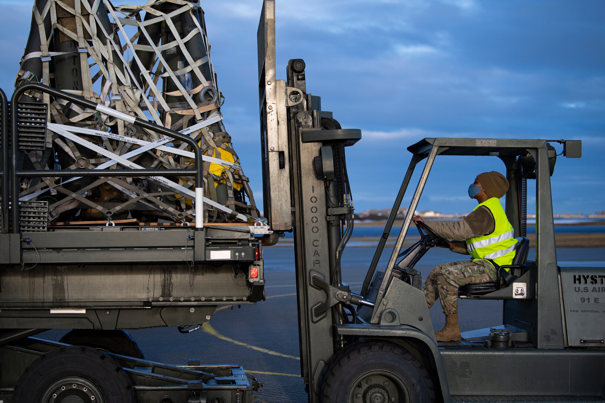 A ground transportation operator, assigned to the 9th Expeditionary Bomb Squadron offloads cargo at Orland Air Force Station, Norway, Feb. 23, 2021. Approximately 360,000 pounds of cargo was transported to Ørland Air Force Station to ensure mission success throughout a Bomber Task Force Europe deployment. (U.S. Air Force photo by Airman 1st Class Colin Hollowell)