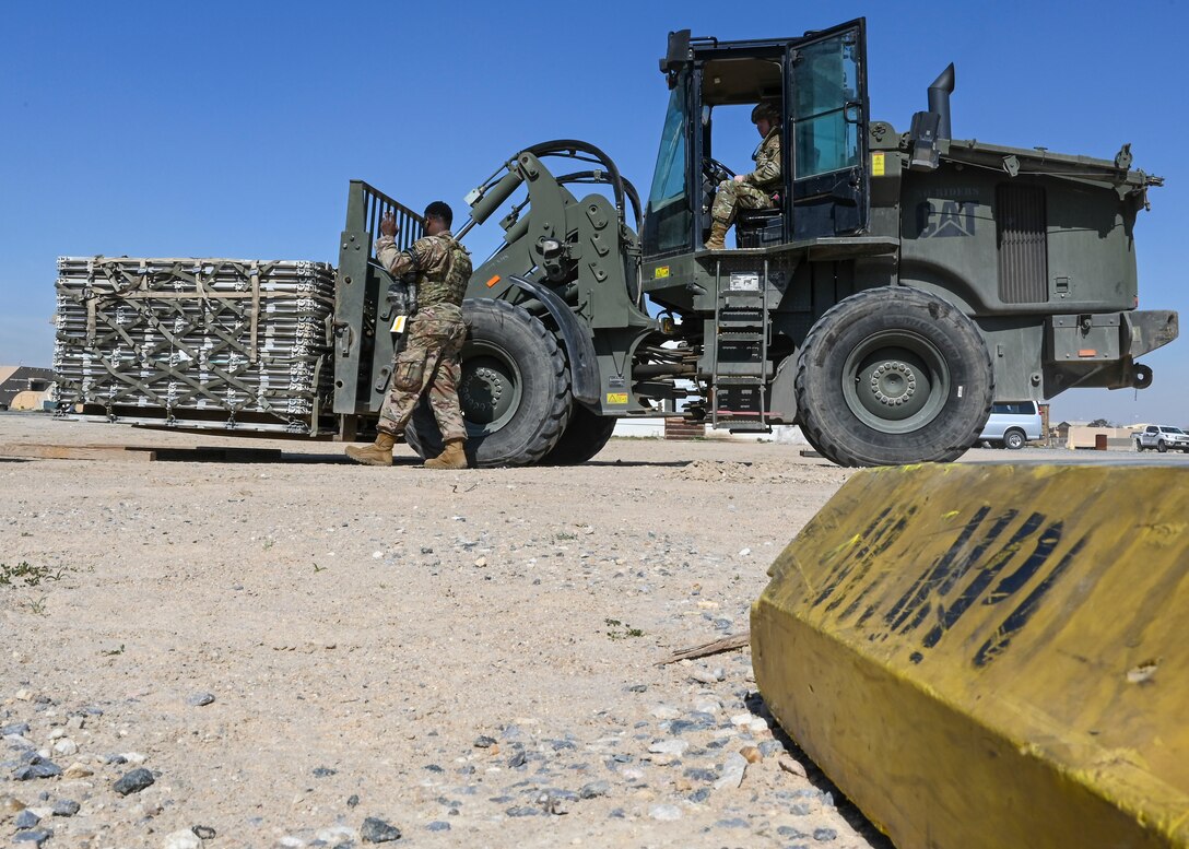 A photo of an Airman driving machinery