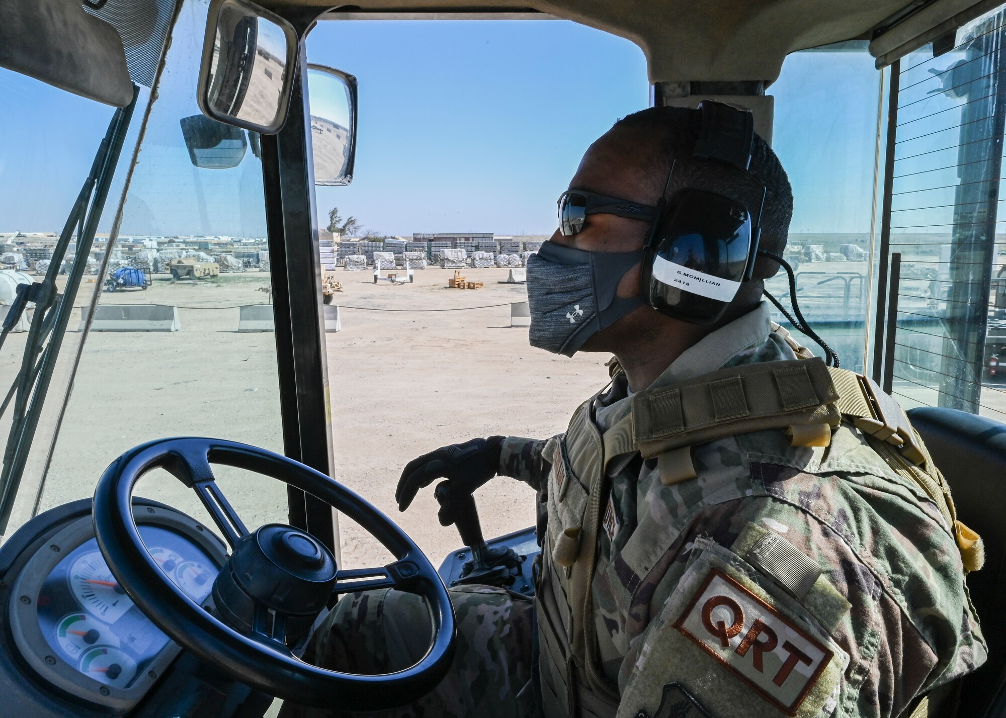 A photo of an Airman driving machinery