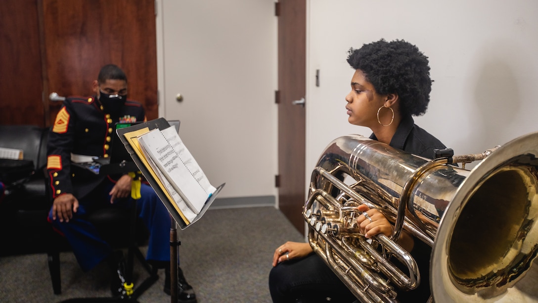 Grace Tifford, right, an applicant with Recruiting Substation (RSS) Rockville, Recruiting Station Frederick, auditions for the Musician Enlistment Option Program at RSS Rockville, Md., on February 23, 2021. The audition required Tifford to play multiple preselected audition excerpts selected by Master Sgt. Justin A. Hauser, the musical technician assistant, for the 4th Marine Corps District to evaluate her proficiency. (U.S. Marine Corps photo by Cpl. Cody J. Ohira)