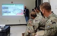 WHINSEC Instructor and former Colombian Army Senior Enlisted Advisor, CSM(RET) Argemiro Posso, briefs members of the 1st Security Force Assistance Brigade (1SFAB) on criminal activity challenges affecting U.S. Southern Command (USSOUTHCOM) Area of Operations (AO). As part of the partnership between WHINSEC and 1SFAB, Institute's Partner Nation Instructors interact with 1SFAB teams in order prepare them for future engagements in the AO.