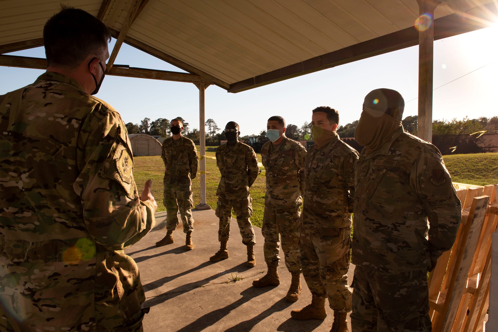 A photo of the 23d Wing commander talking to Airmen.
