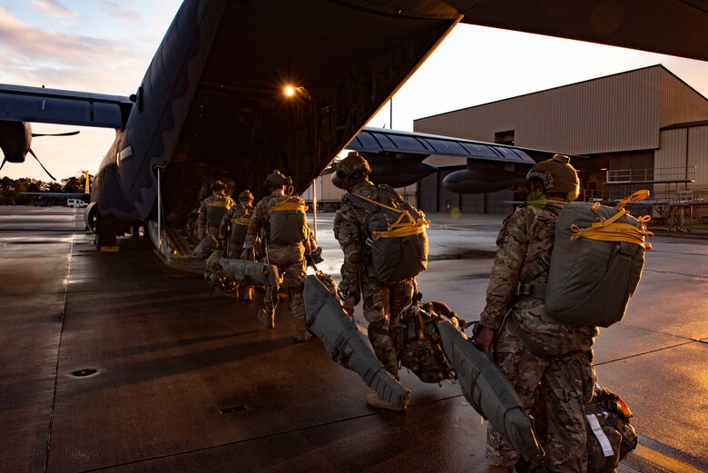 A photo of Airmen loading onto an HC-130J Combat King II.
