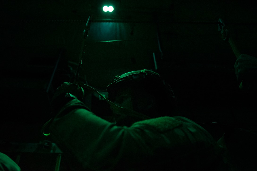 A photo of an Airmen waiting for instruction during an airborne jump.