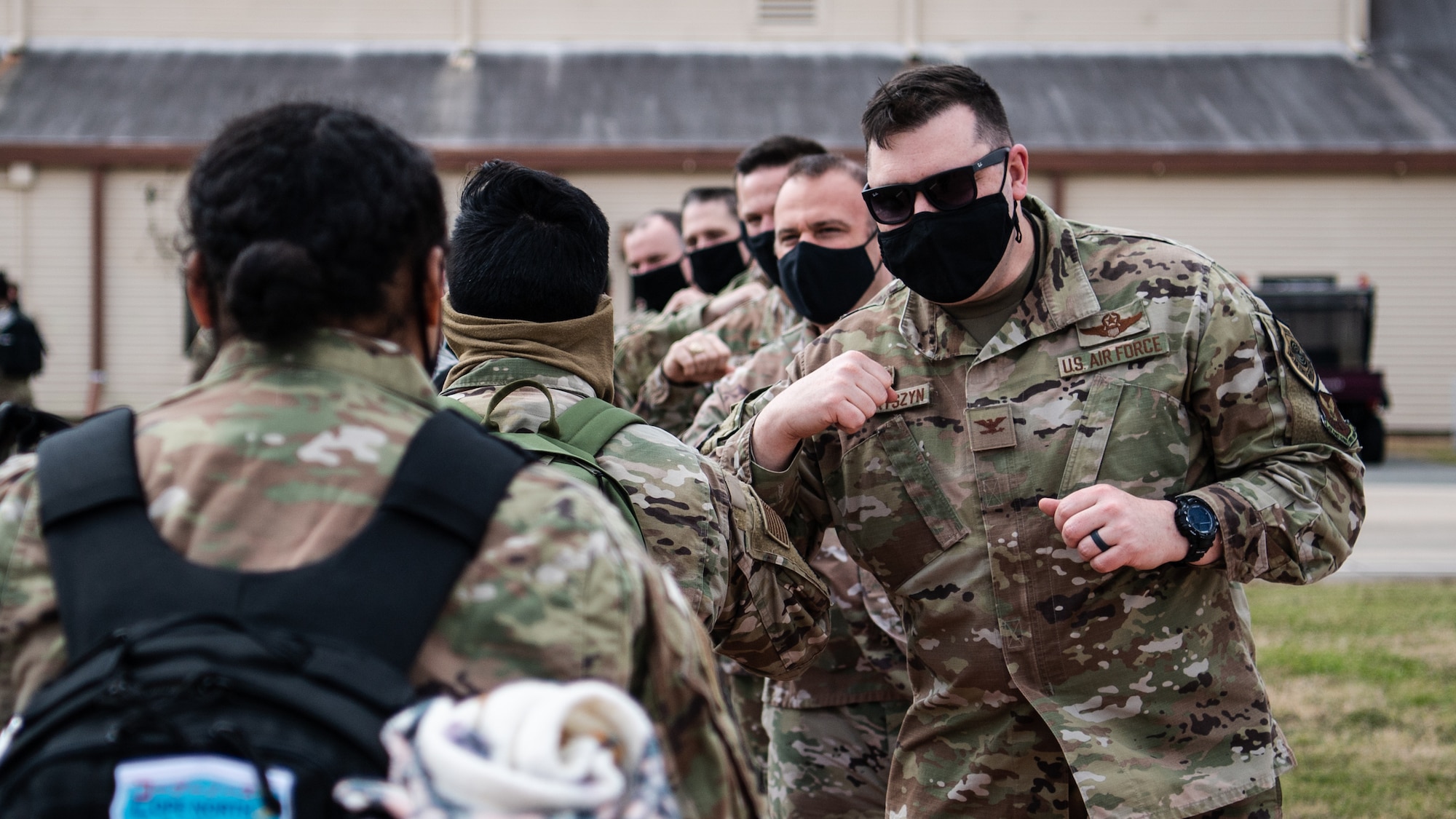 Airmen from the 2nd Bomb Wing are greeted by Col. Mark Dmytryszyn, 2nd BW commander, and other base leaders upon returning to Barksdale Air Force Base, La., Feb. 24, 2021, after a Bomber Task Force deployment to Andersen Air Force Base, Guam. The BTF brought B-52H Stratofortress bombers and 2nd BW Airmen to the Indo-Pacific theater to test their ability to integrate and operate from a forward location. (U.S. Air Force photo by Airman 1st Class Jacob B. Wrightsman)